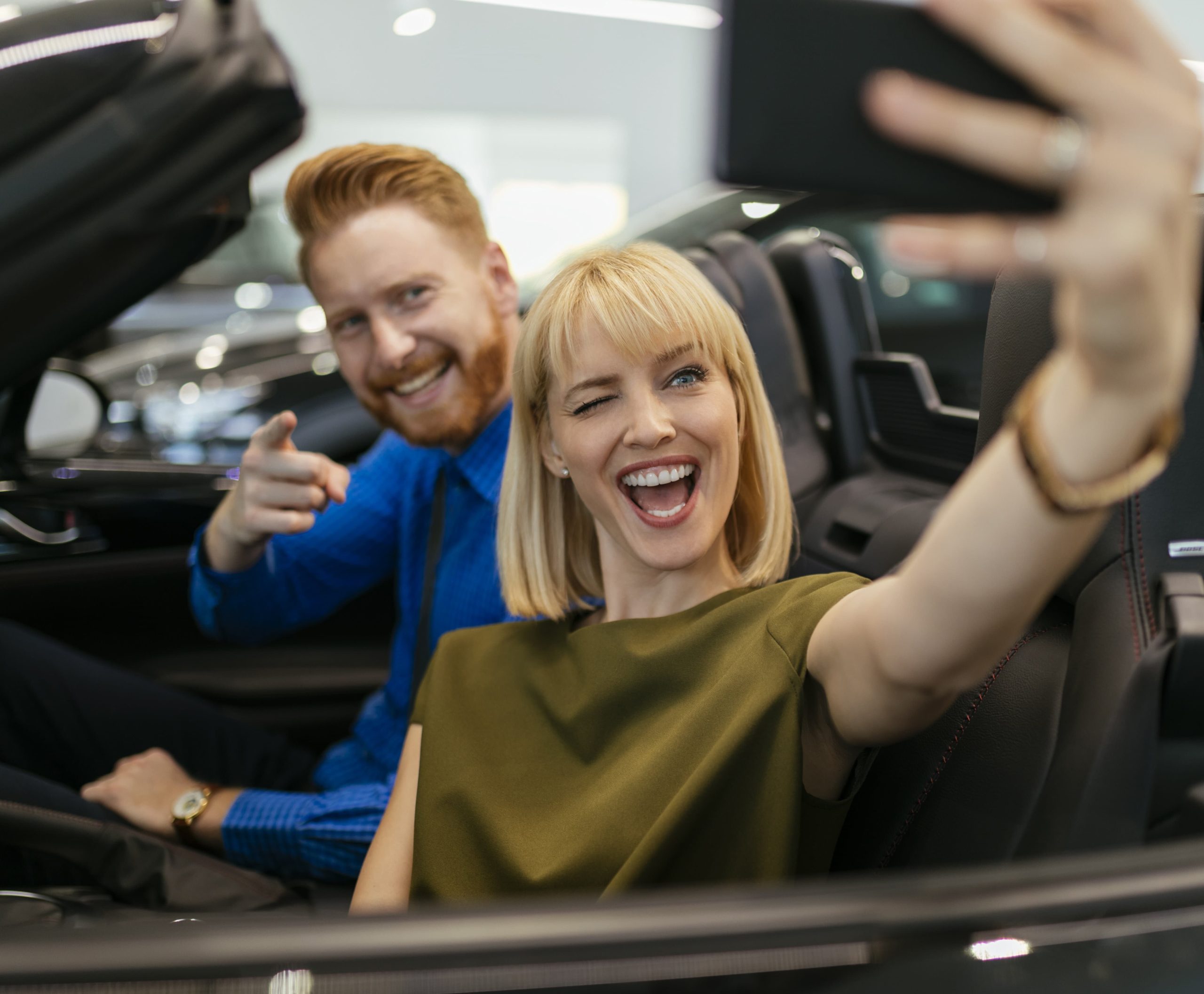 Couple Taking a Selfie in a New Convertible